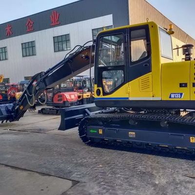 Μακρύς εκσκαφέας βραχιόνων με τις λαστιχένιες διαδρομές
